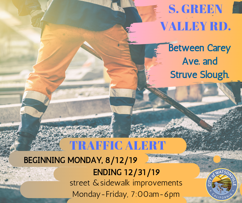 worker working on the road with information on traffic alert