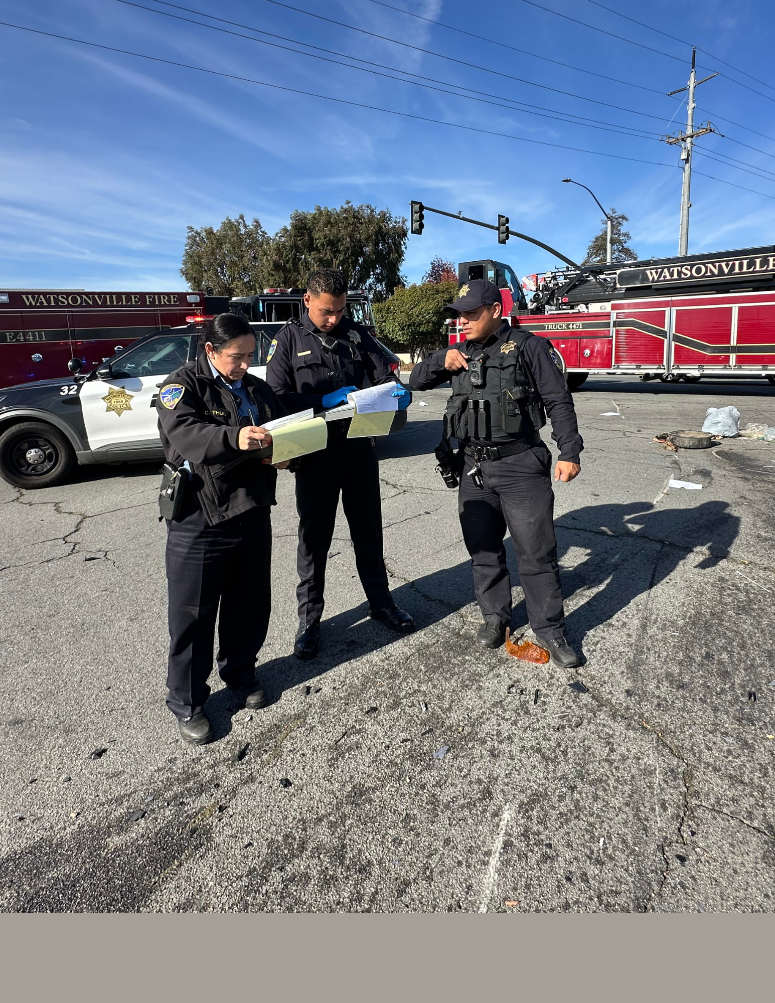 Two Officers and a PSS working together investigating a crash