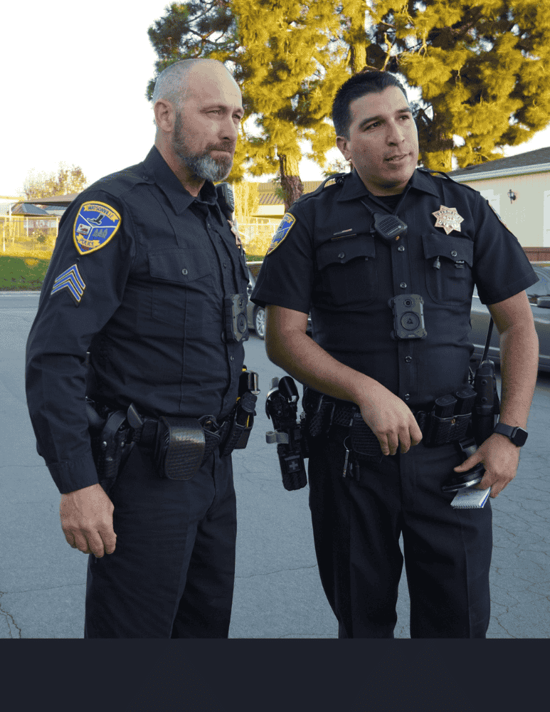 Officers at a scene discussing case 