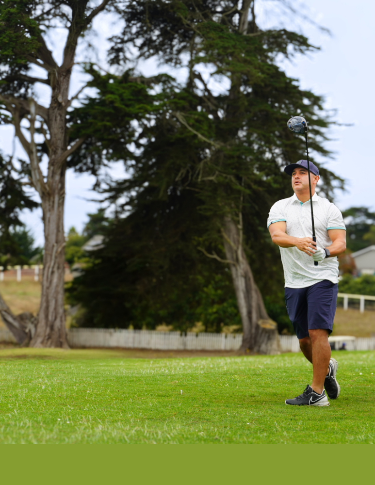 Golf player in full swing 