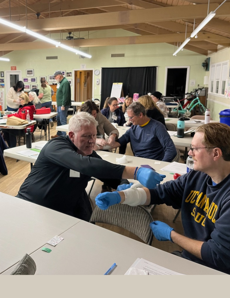 Participants learning how to put on bandages 