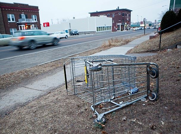 Shopping cart laying on side