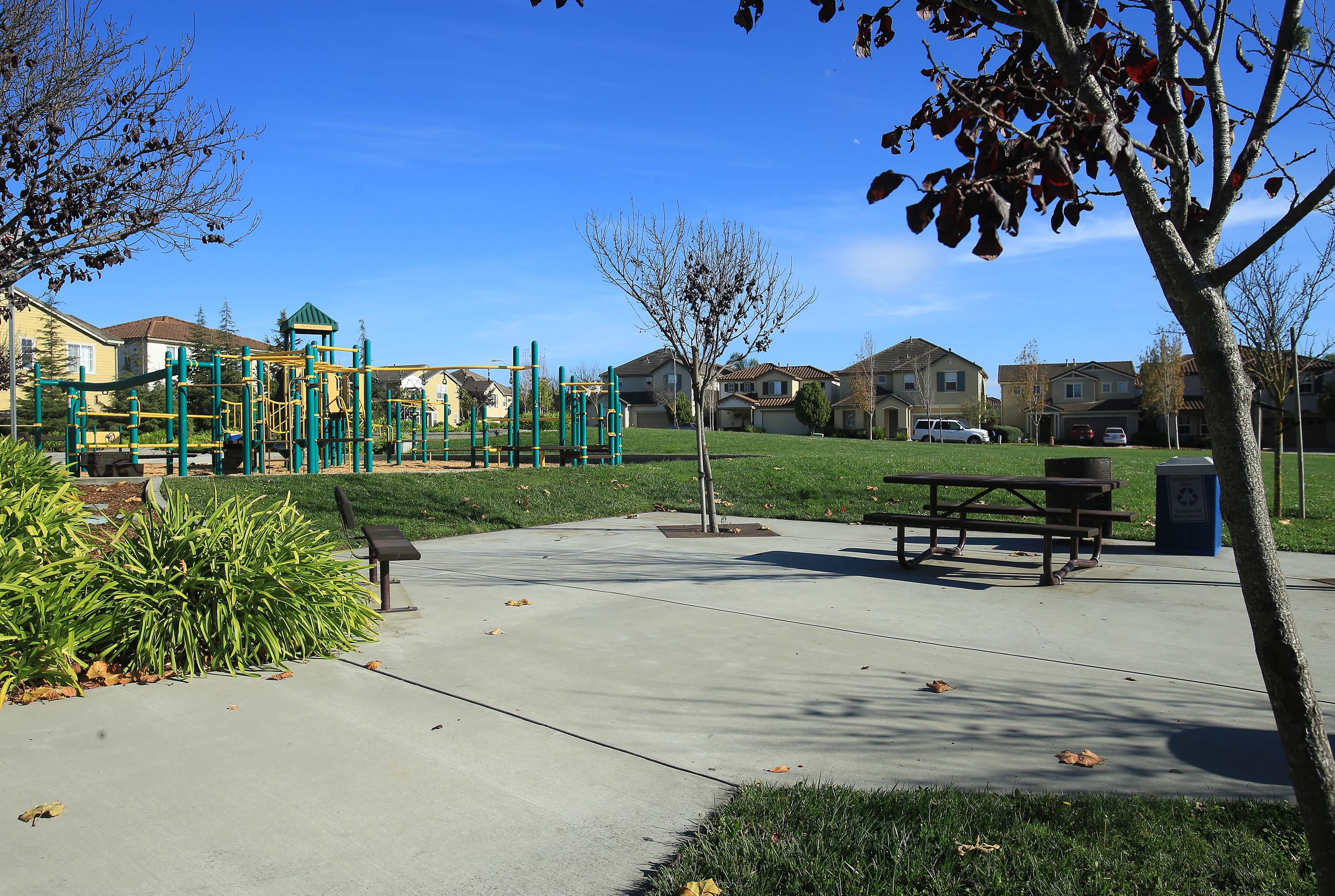 Concrete patio and playground structure at Las Brisas park 