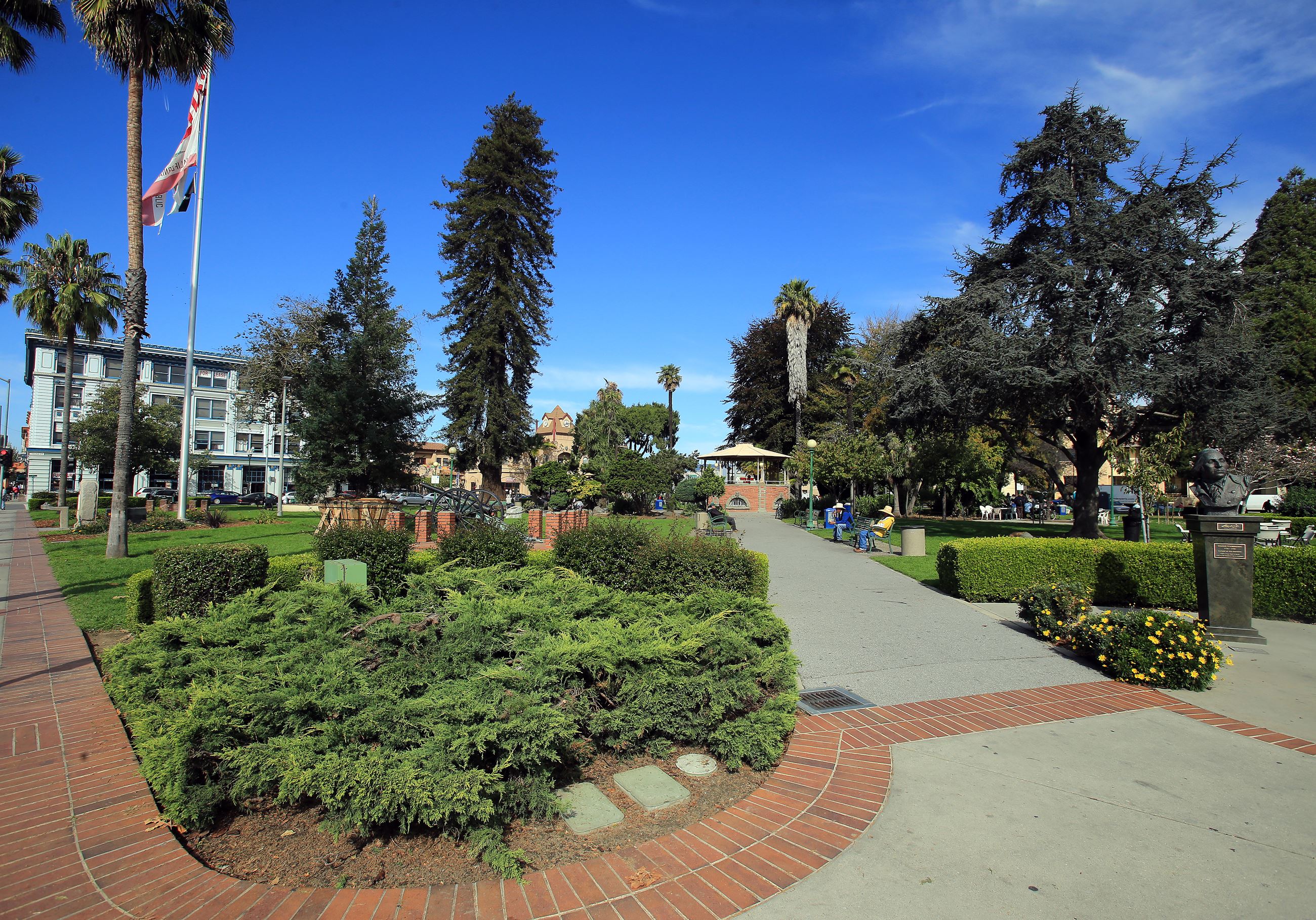 Plaza park with plants and brick path