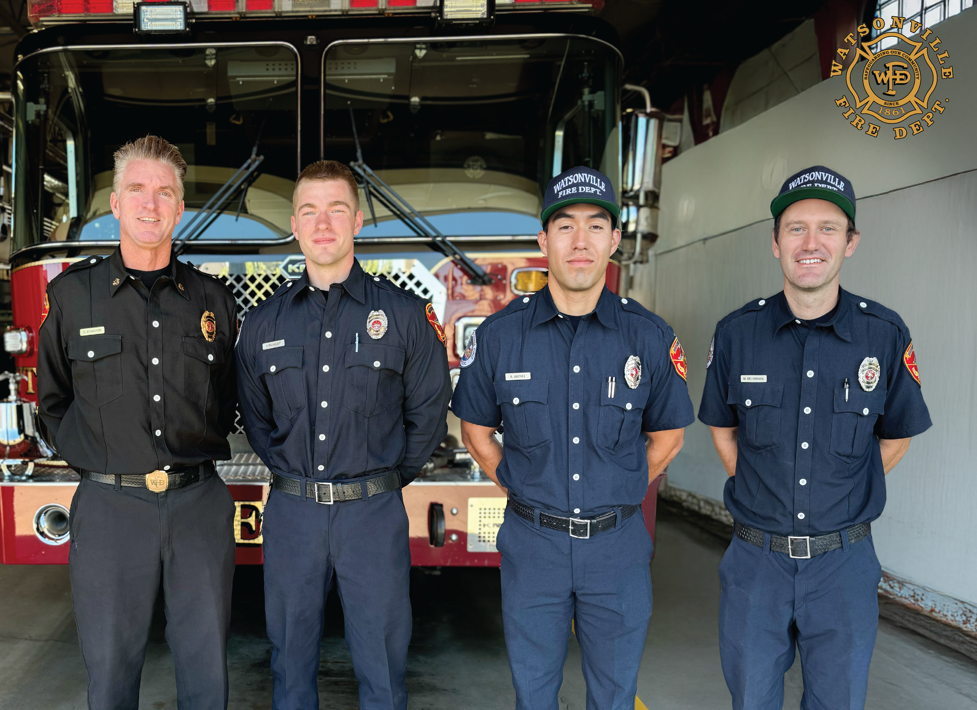 Chief Shaefer in front of a fire engine with four new firefighters 
