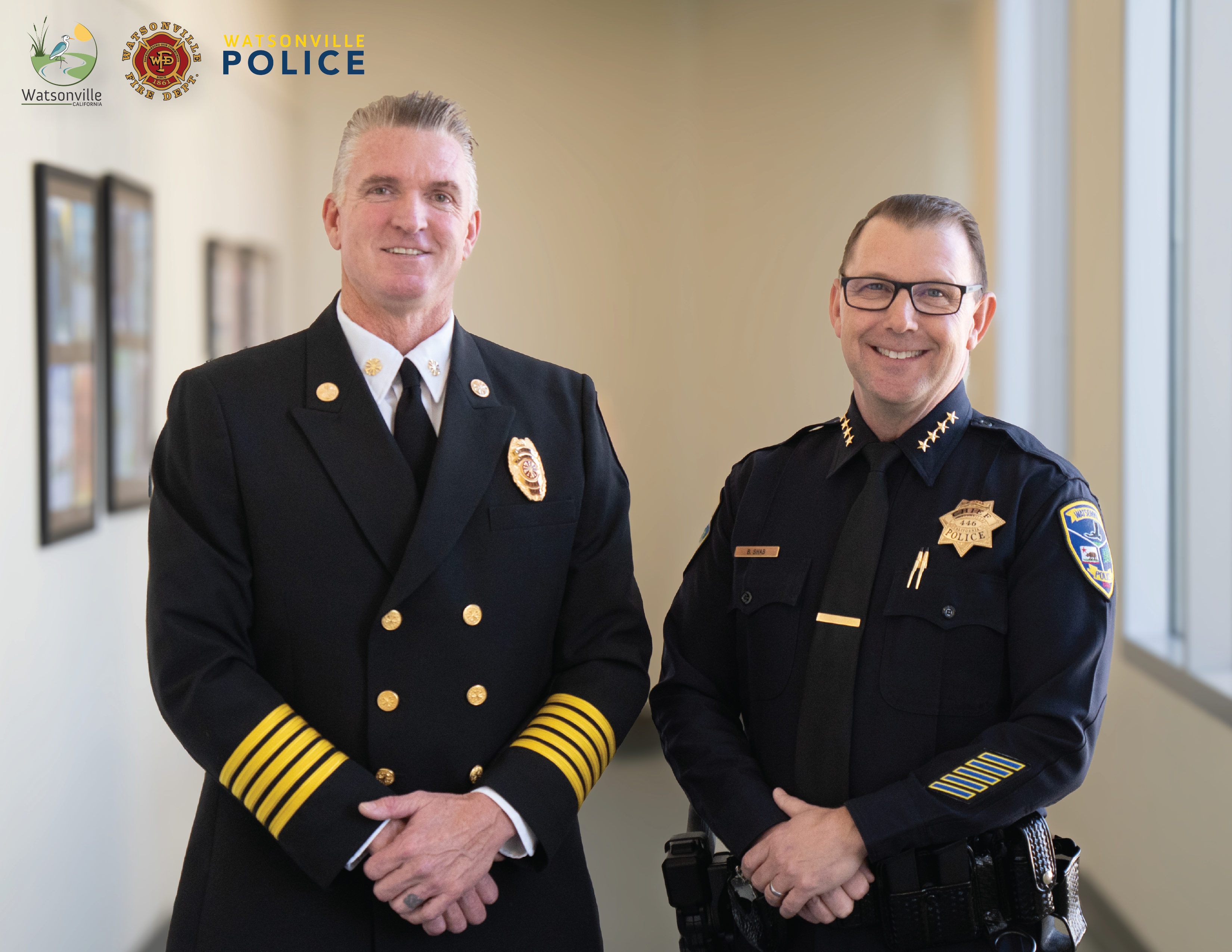Fire Chief Corey Schaefer and Police Chief Brian Shab stand side by side indoors