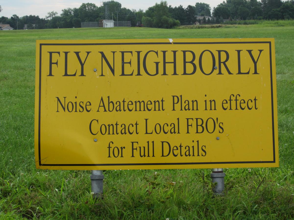 Fly Neighborly, Noise Abatement Plan in Effect, Contact Local FBOs for Full Details Sign